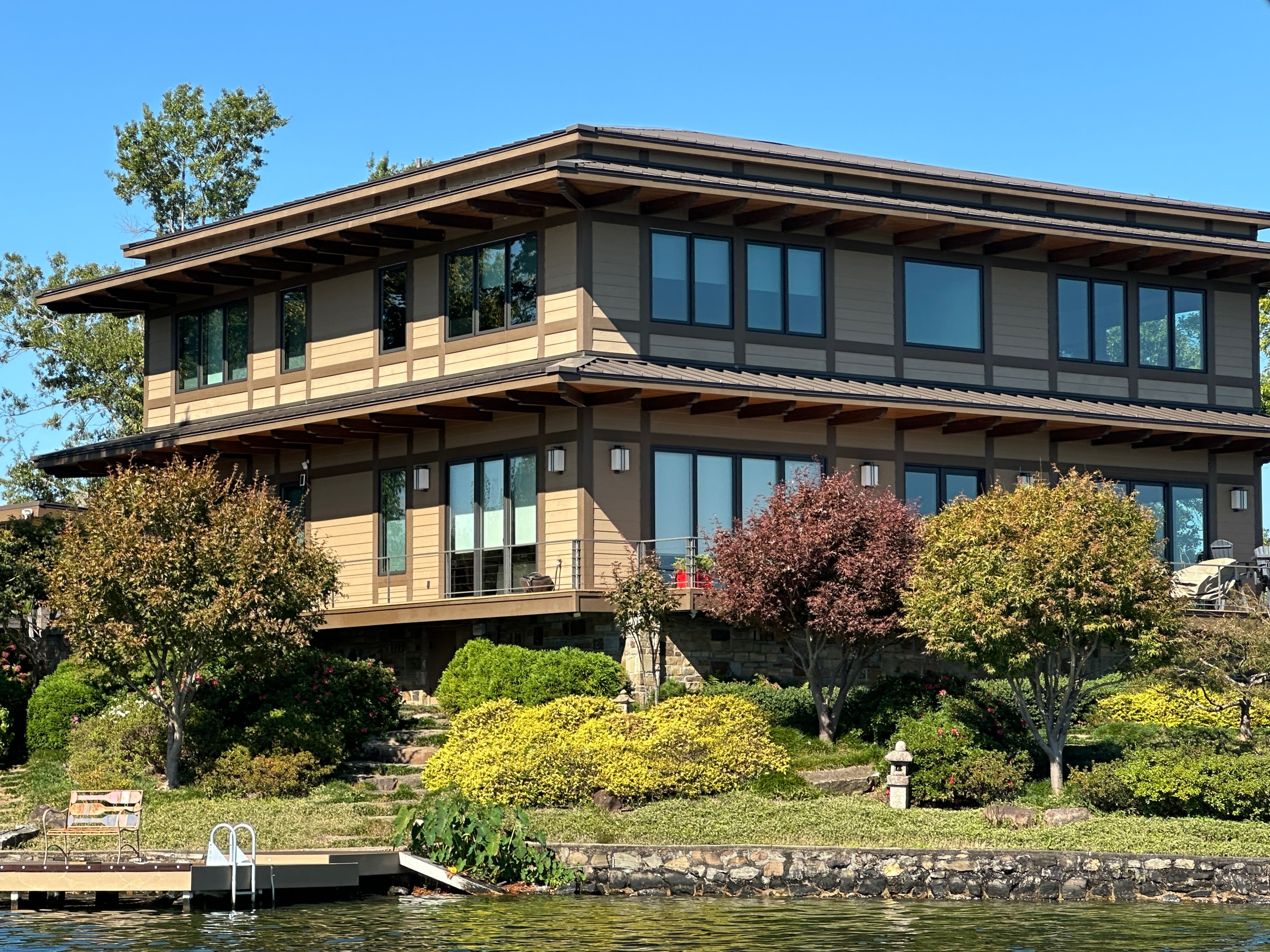 Craftsman-style lakefront home with landscaping on Lake Hamilton