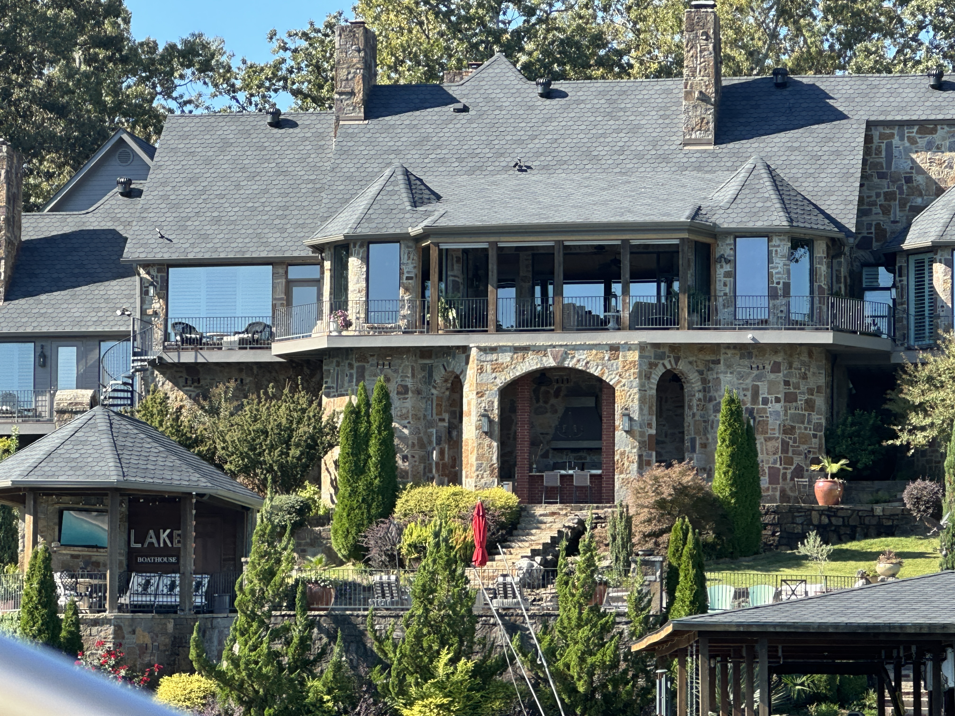 Stone estate with European architecture on Lake Hamilton