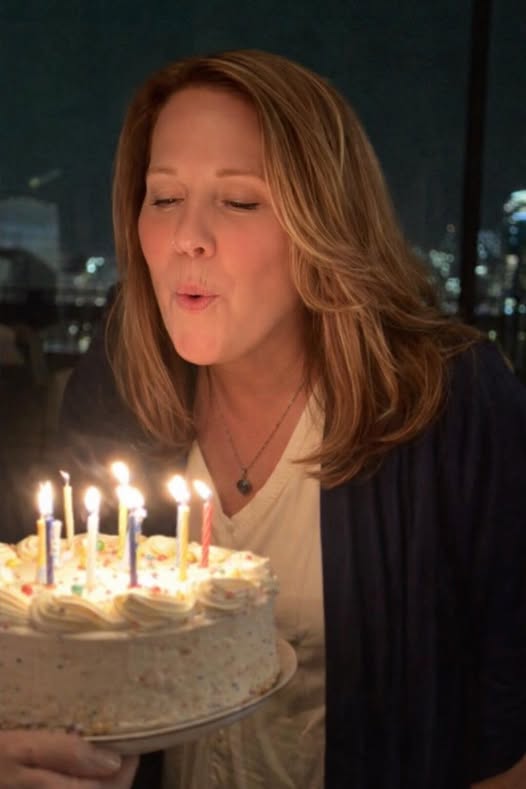 Nancy blowing out birthday candles
