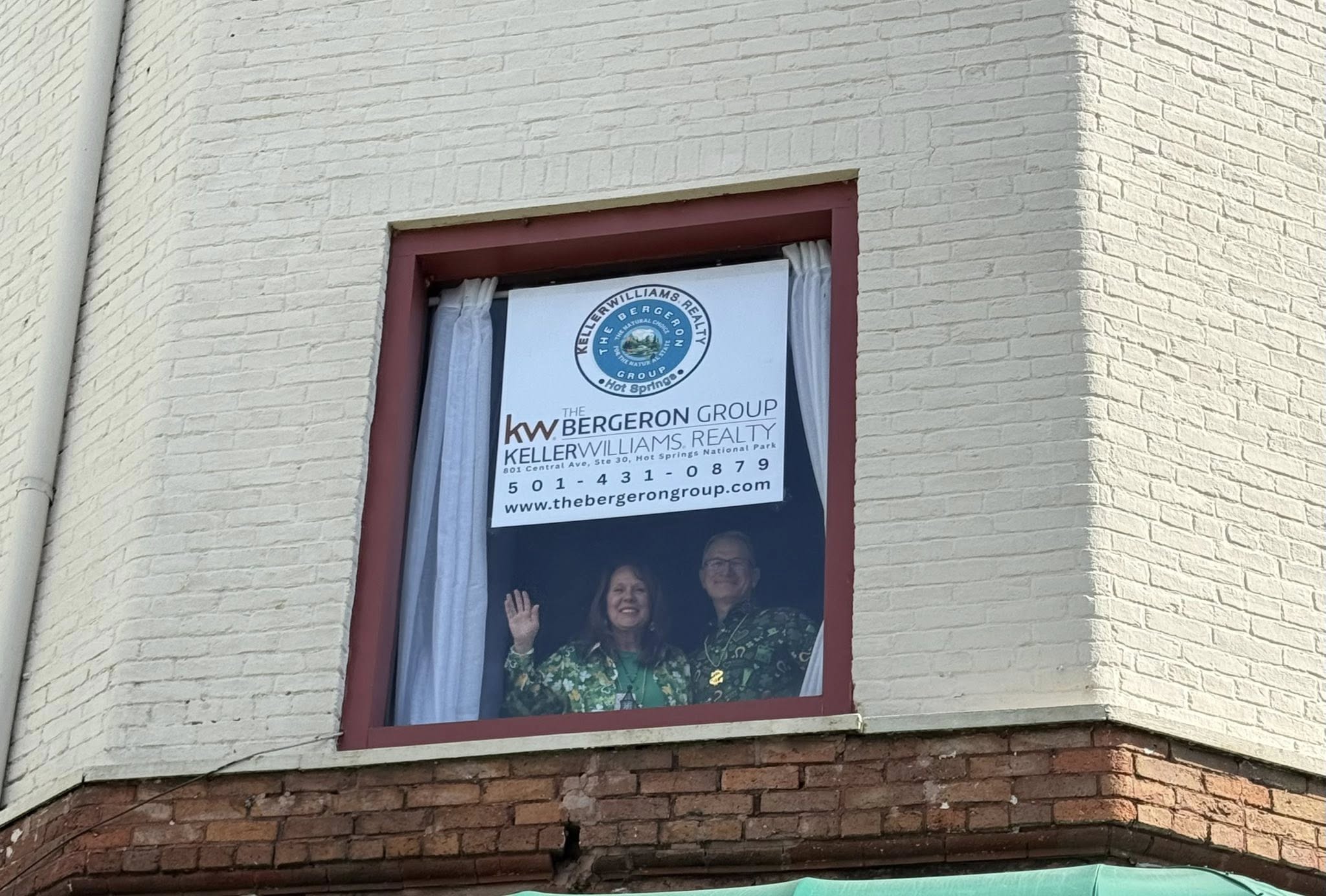 Nancy and Mark at Bergeron Group office window